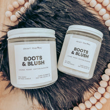 Load image into Gallery viewer, Two candles on a black fur surface with wooden beads around it