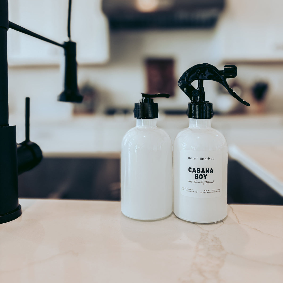 Two bottles labeled 'Cabana Boy' on a kitchen counter.