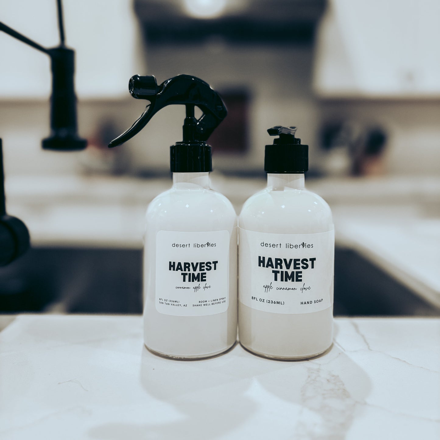 Two bottles labeled 'Harvest Time' on a kitchen counter.