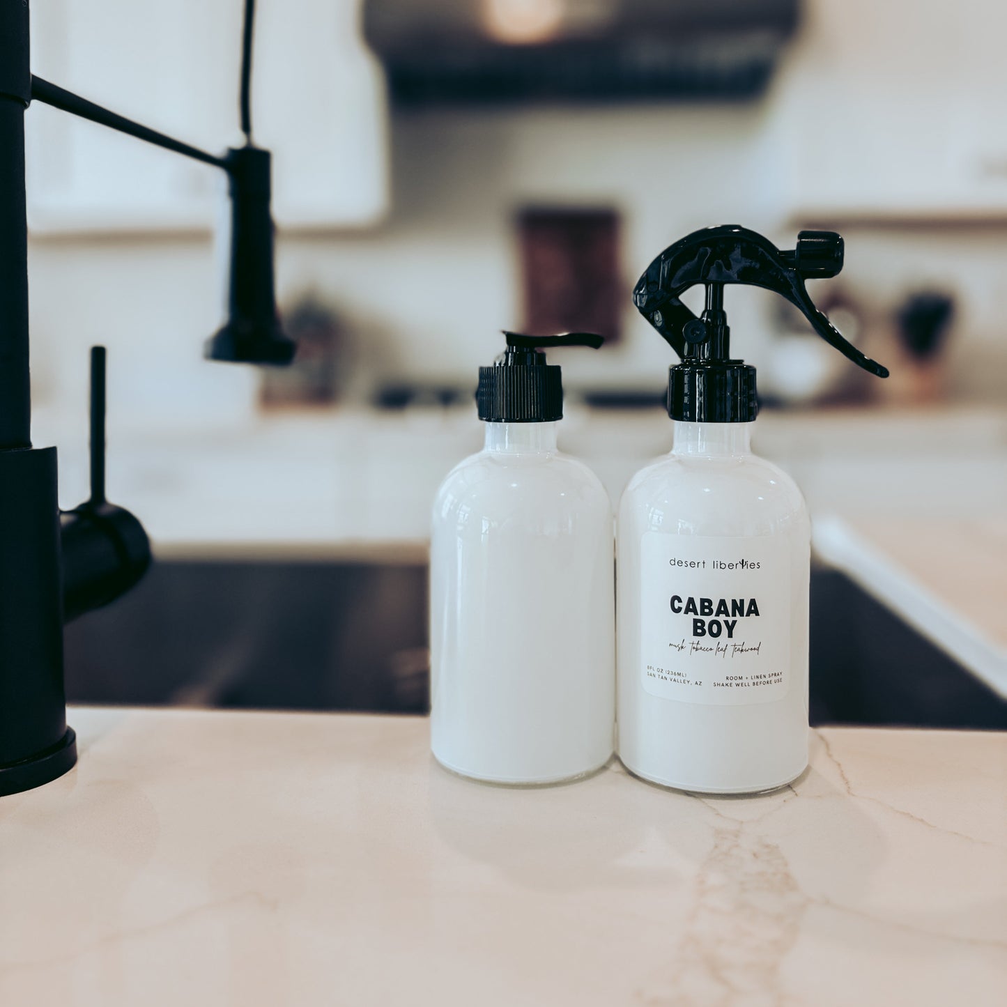 Two bottles labeled 'Cabana Boy' on a kitchen counter.