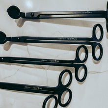 Load image into Gallery viewer, Set of black wick trimmers on a marble surface
